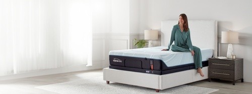 Woman sitting on ProAdapt mattress