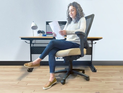 A woman working in an office chair